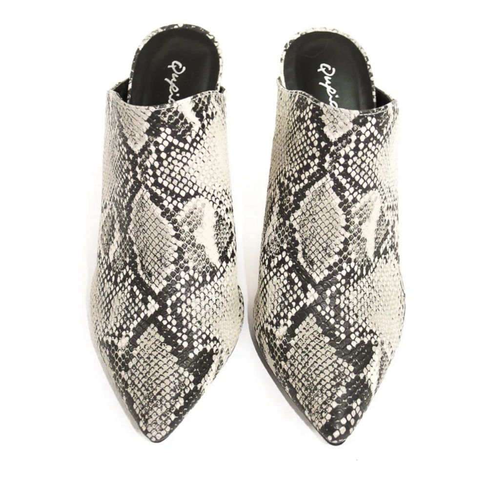 Snake embossed mule.